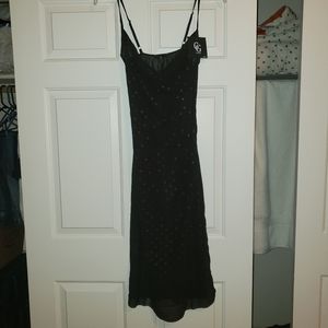 Star patterned black draped dress